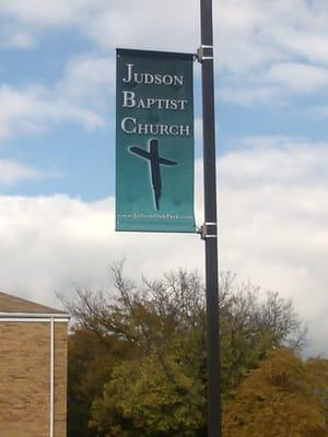 The church patking lot is located across the street. Look for the church poles.