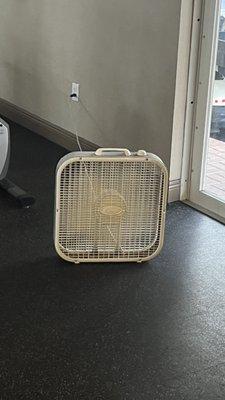 The rusty fan they threw in the gym while they take weeks to do the repairs.