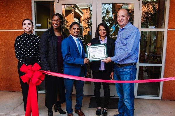 Ribbon cutting - Mayor Robert Rickman handing over the certificate