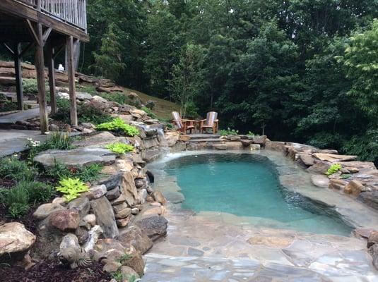 Swimming pools designed to fit site - Here is a natural mountain spring set into side of the mountain.