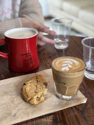 Half eaten cookie with a London fog and a cortado with my name written on it