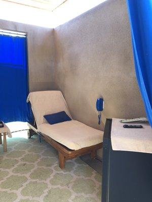 Lounger and fridge in cabana