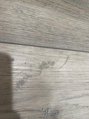 Caulk tracked throughout new flooring