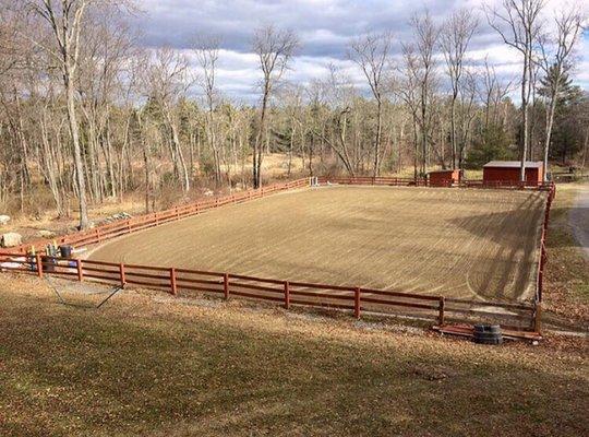 The 140x90 foot sand riding ring is fully lit, equipped with speakers, and a small jump course.