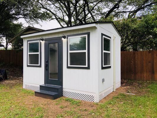 The finished product. We added vinyl skirting, custom steps, and corner molding to match the house.