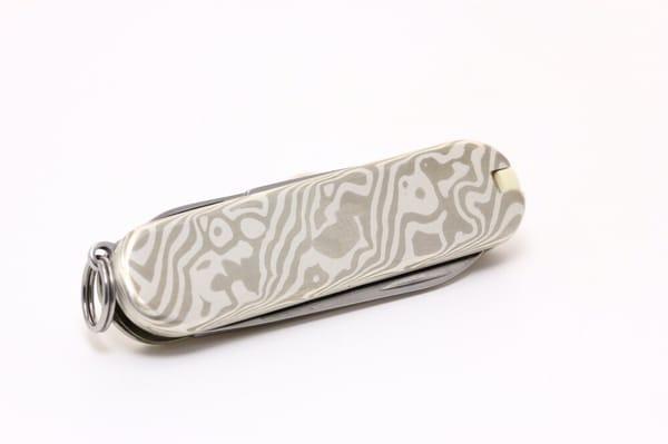 Custom Victorinox Swiss Army Knife in sterling silver and nickel mokume gane (wood grain metal).