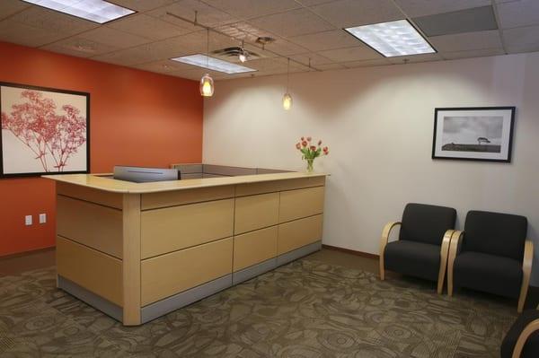 Front desk reception at Office Evolution Boulder.  Our Business Center Manager sits behind this desk and is here to greet you & your guest.