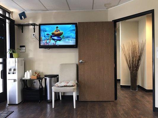 Waiting area with cartoons on.