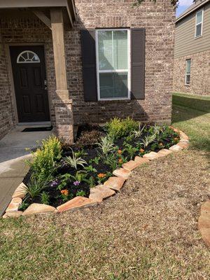 Flower beds designed in front our coustomer front yard.