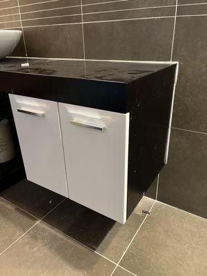 Remounting a floating bathroom vanity into tile.