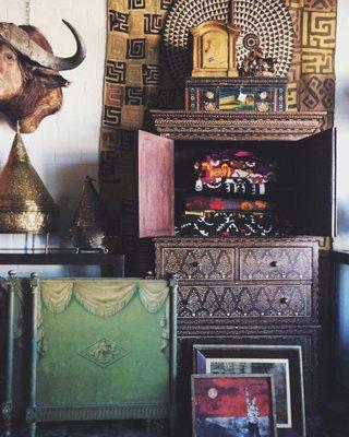 An eclectic mix of vintage and handmade textiles, furniture, art, and home accents and accessories