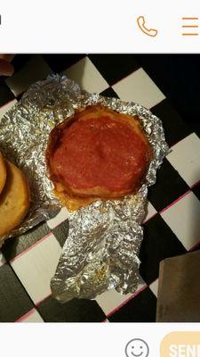 This is lunch. Two pieces of see though salami and one piece of cheese burnt on a bagel .