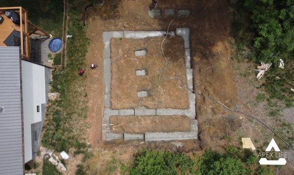 Pouring footings for the house foundation