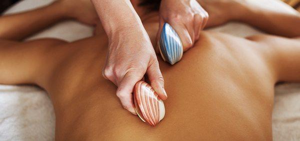 Lava Shell massage is a type of heat treatment that uses Tiger Clam shells as a massage tool.