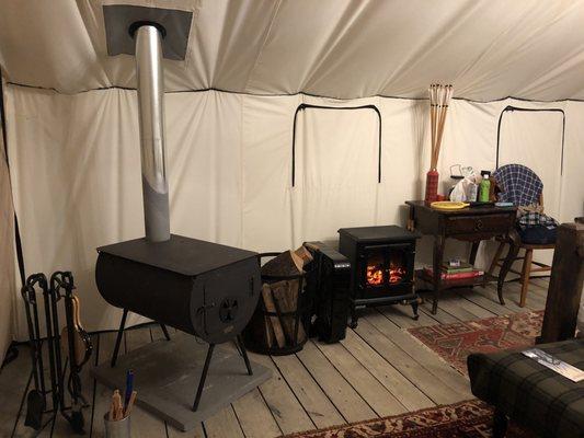 Wood fire stove, heater, table, books, games.