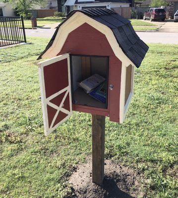 A free lending library is near the playground.