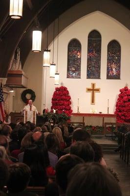 Father Rob gives a homily during Mass