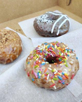 Classic Sprinkle, Coffee Cake and Coconut and Black Sesame vegan donuts