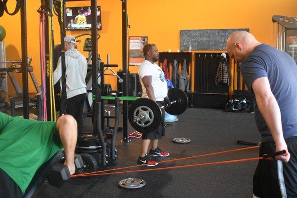 Group workouts at Revolution Fitness still allow for personalized attention from a trainer.