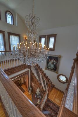 Be wowed by the dazzling chandelier as you ascend up the grand stairway.