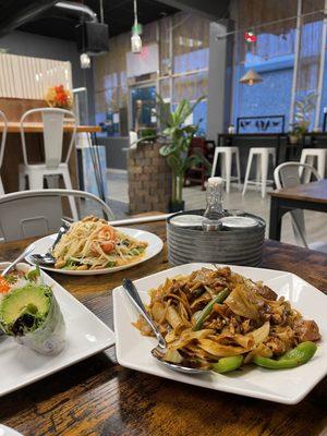 Drunken noodle (closest), papaya salad and avocado spring rope.