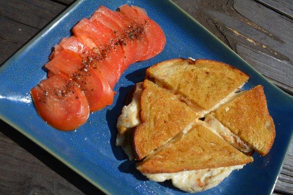 Sourdough grilled bread, olive oil, 40% ricotta, 60% mozzarella cheese, salt pepper, marinated tomatoes, (on top)