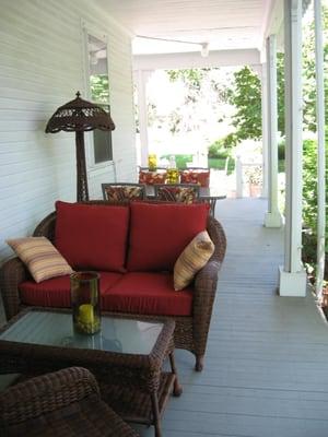 Guests can enjoy the side porch for breakfast and throughout the day.