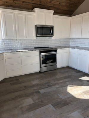 Wood tile Floor
 Subway tile back splash