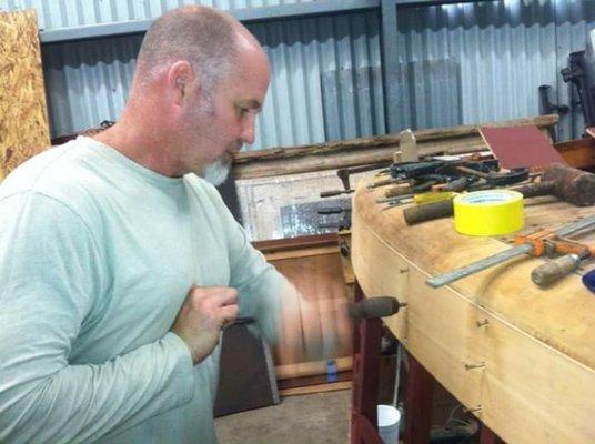 Transom replacement on Chris Craft.  A brace is used to install bronze fasteners to prevent stripping the head.