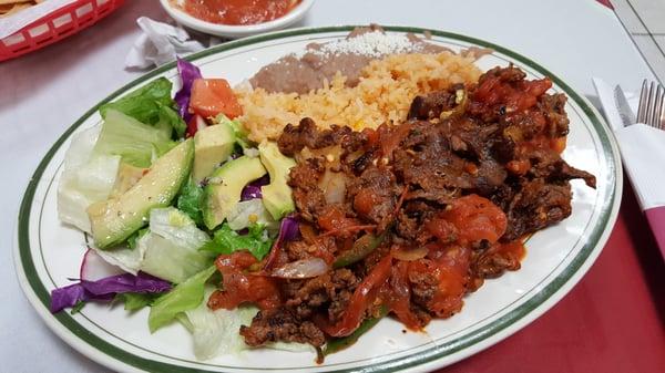 Bistec a la Mexicana. Comes with salad, corn tortillas,  and rice and beans. Great portion for price!