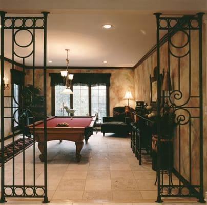 A living room converted into a game room and bar