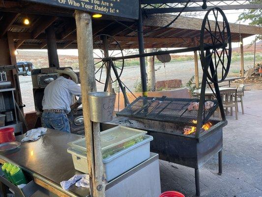 This is the grill where the steak is cooked.  The grill swings.