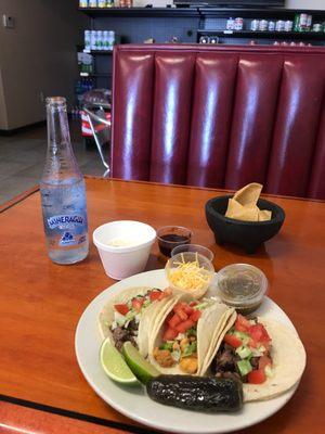 Three tacos and horchata with a little mineral water from Jarritos