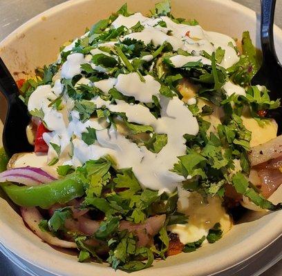 Chicken Queso bowl with sour cream and cilantro